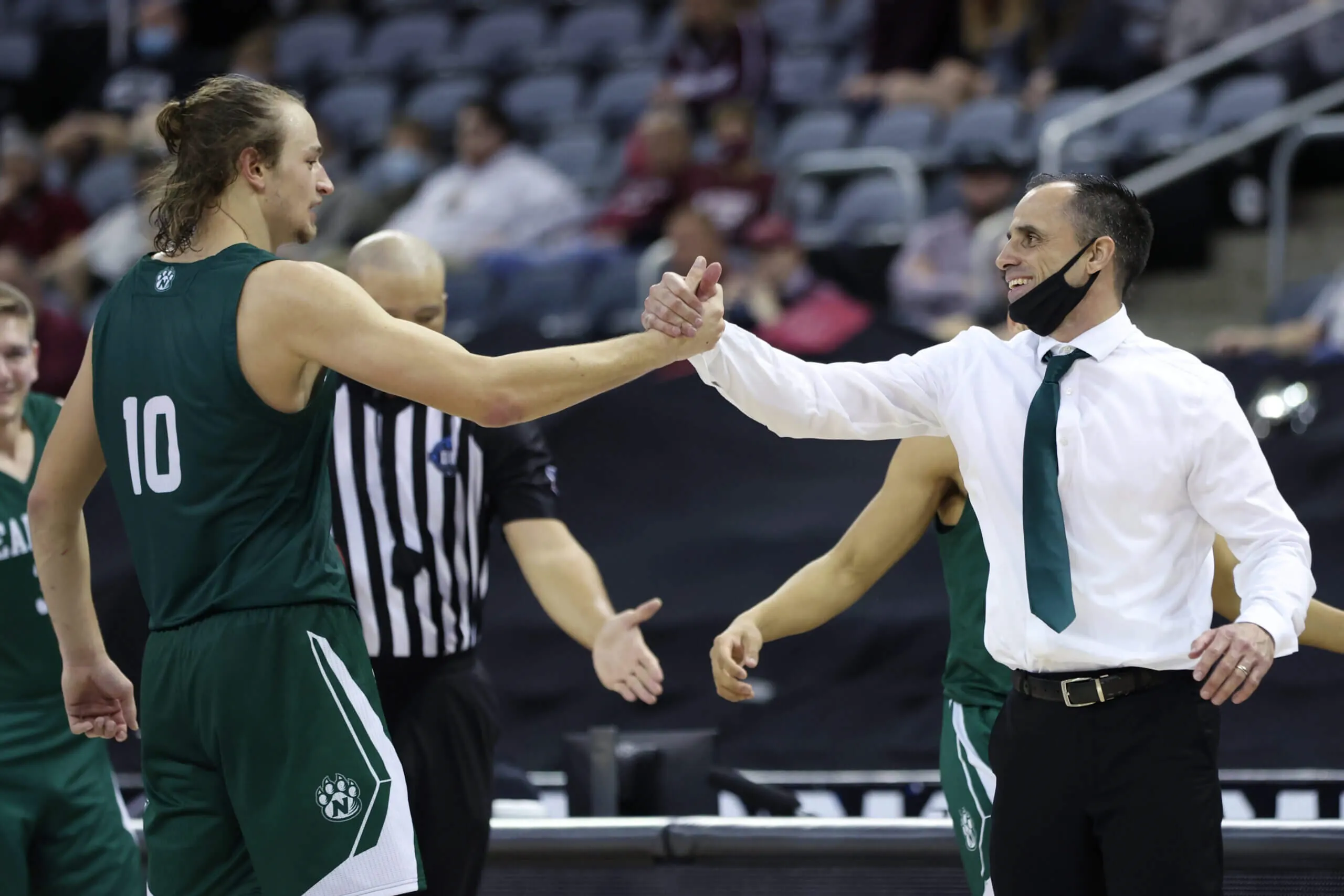 Coach handshake with player