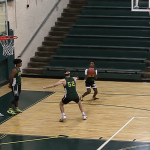 Late hand basketball closeout after the shooter has already started the shooting motion